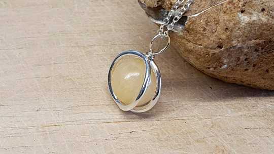 Aragonite circle pendant