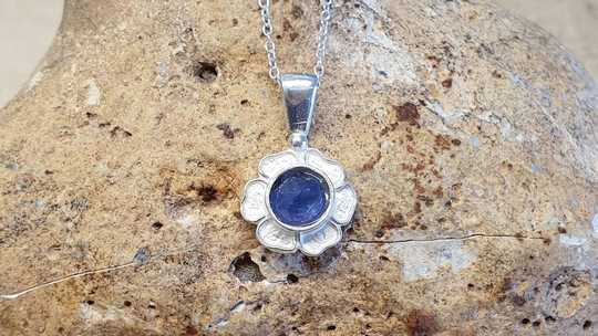 Tiny Tanzanite flower pendant